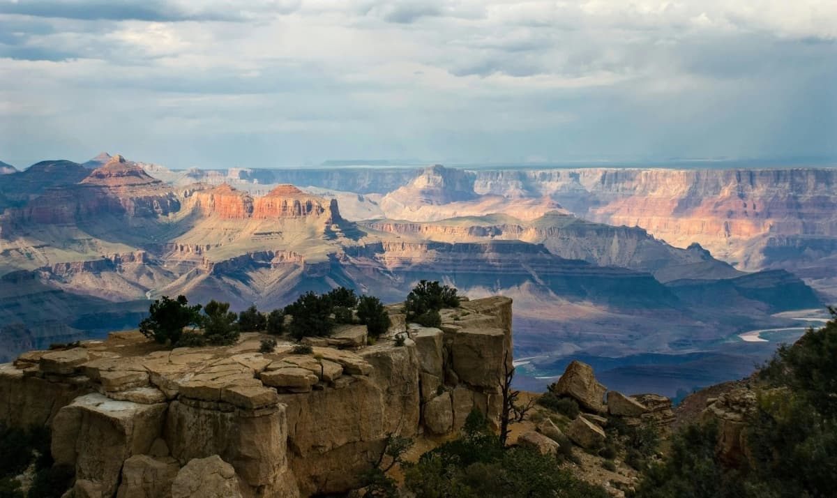 Layered red rock walls of the Grand Canyon glowing at sunset from the South Rim in Arizona