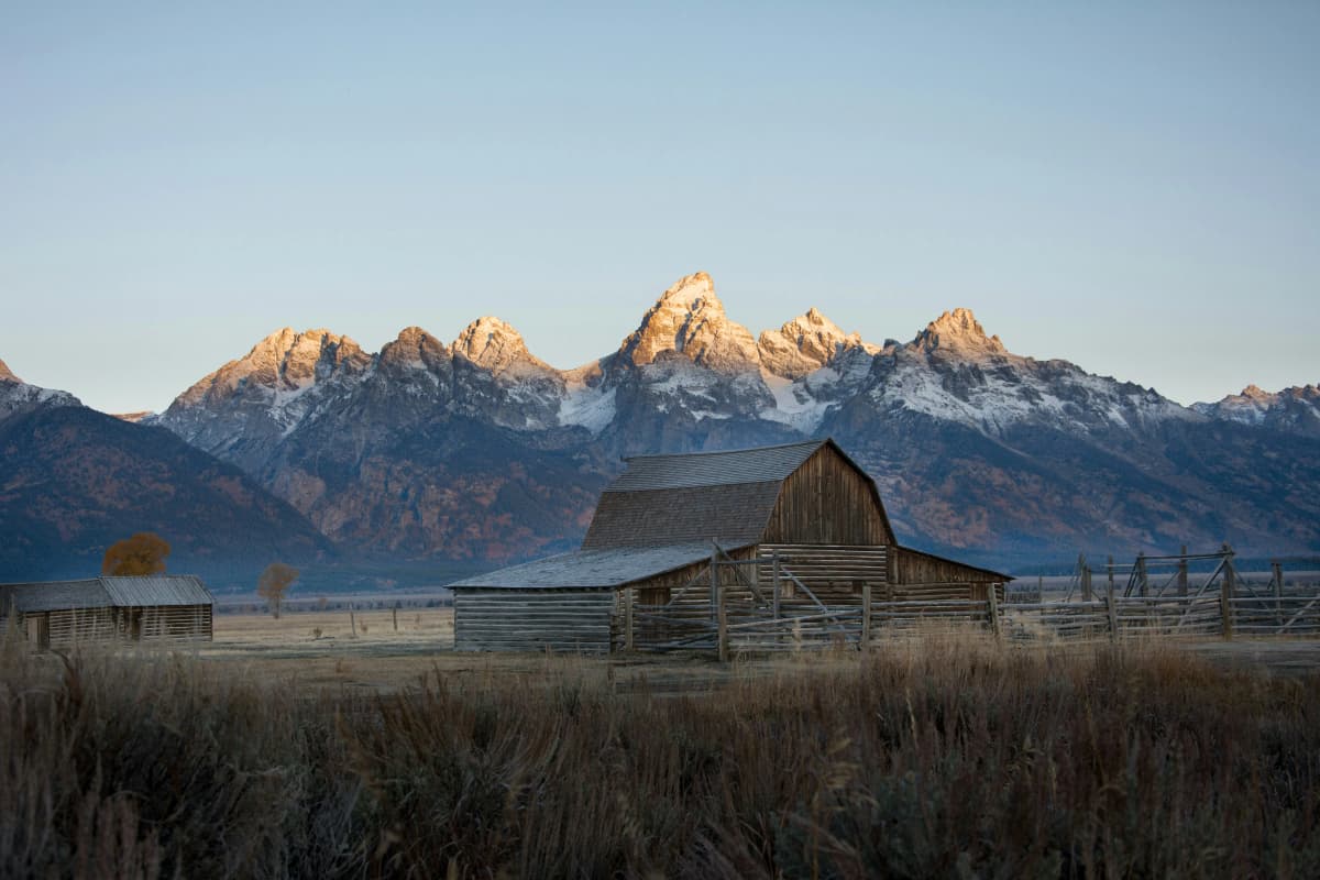 Historic T.A. Moulton Barn on Mormon Row with the Teton Range behind it in Wyoming