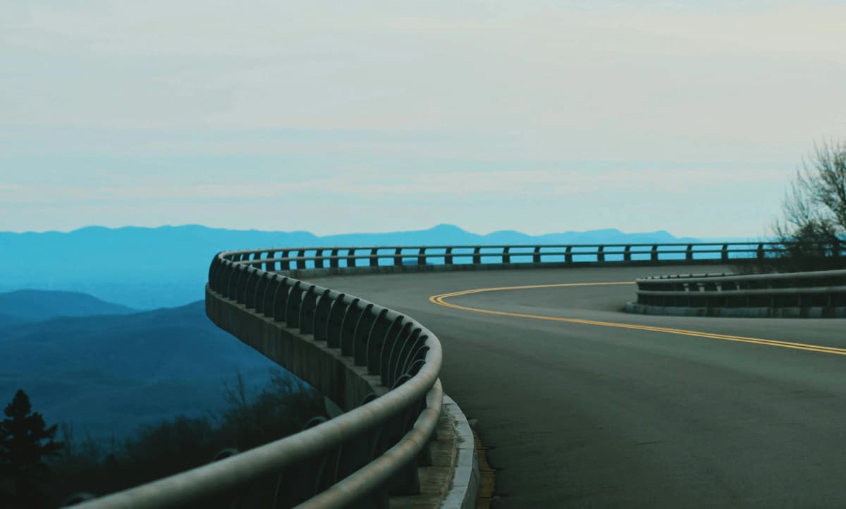 The Blue Ridge Parkway winding through layered mountain ridges in Western North Carolina