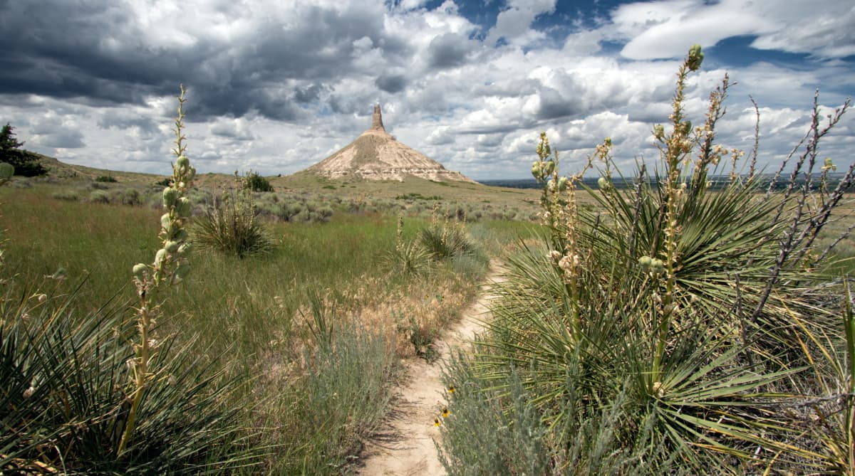 Chimney Rock rising above the open prairie of the Nebraska Panhandle under a wide sky