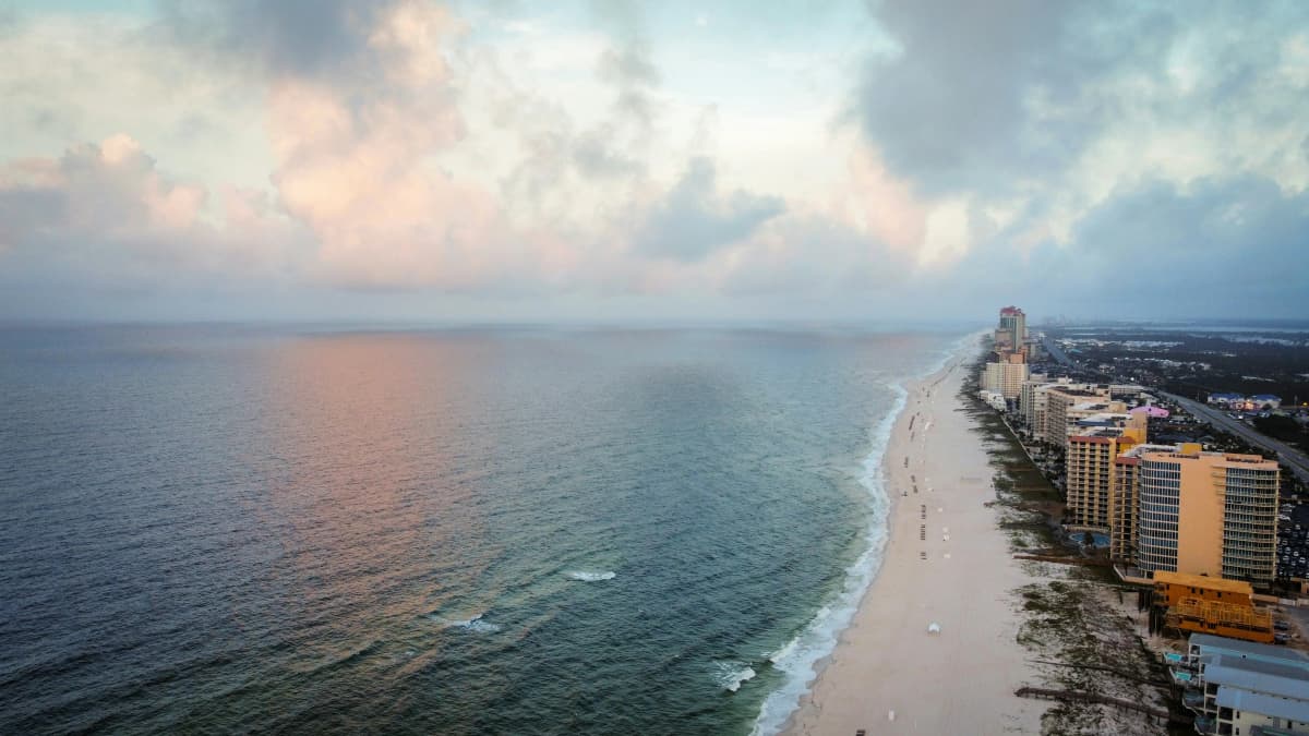 White sand beach and turquoise Gulf of Mexico water along the Alabama coast at Gulf Shores