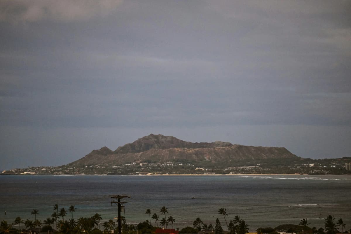 Diamond Head crater rising above Waikiki Beach and the turquoise water off Honolulu