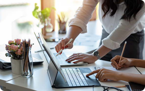 pointing to a desktop computer screen